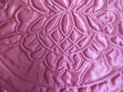 Pink satin case detail of quilting