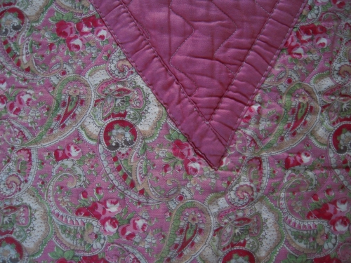 Pink quilt detail of flat seams