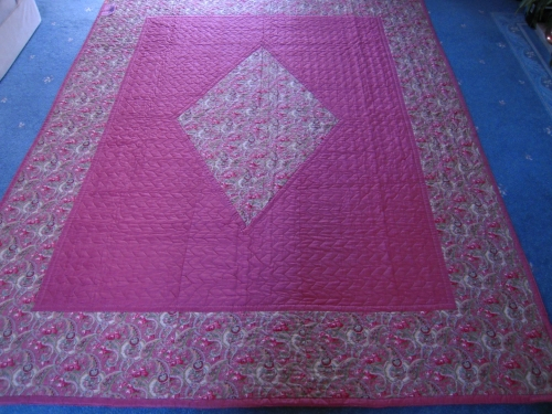 Pink quilt with paisley diamond