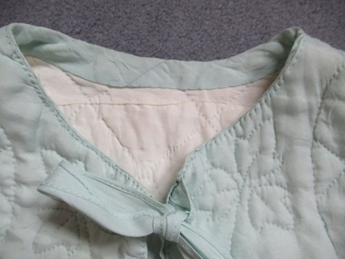 blue cape detail of neck