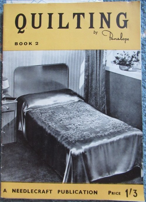 Penelope leaflet with satin quilt on bed