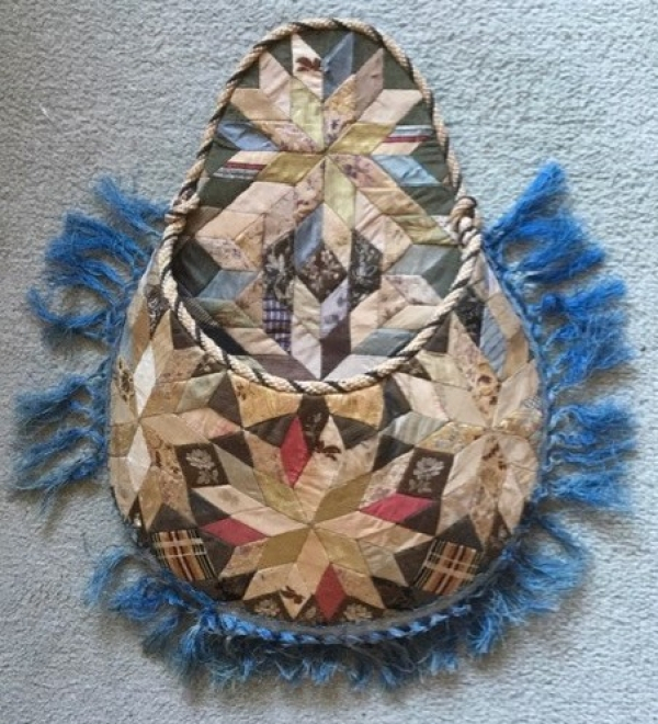 Pouch in diamond patchwork with blue fringe