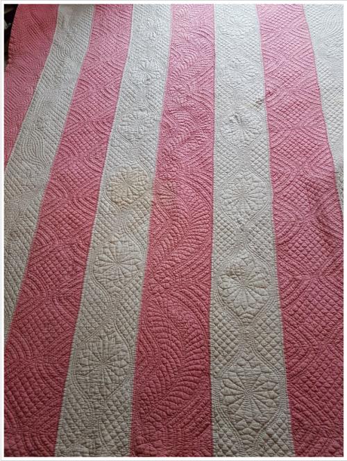Pink and white strippy quilt