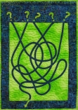 Green and blue quilt design depicting a maze puzzle