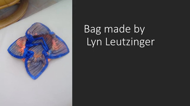 A blue and orange, flower-shaped bag.