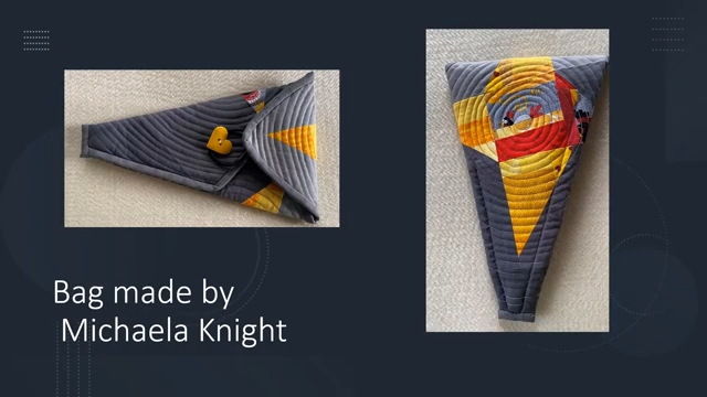 a triangular, quilted bag. The left image shows the back side of the bag, with a heart-shaped yellow button. The right image shows the front of the bag with colourful patchwork piecing in yellows and reds. The background of the pouch is a slate grey..