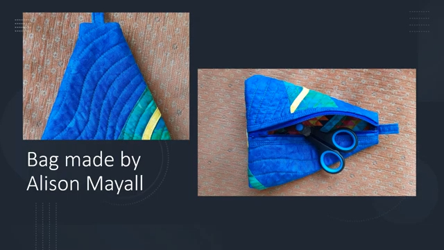 Two images of a triangular, quilted bag. The left image shows the bag closed, with a blue background and a colorful, geometric design. The right image shows the bag open, revealing a zippered pocket and scissors inside.