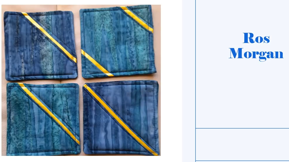 Four square coasters with a blue background. Each coaster features a yellow diagonal line on the blue background. The background has a textured, marbled effect. 