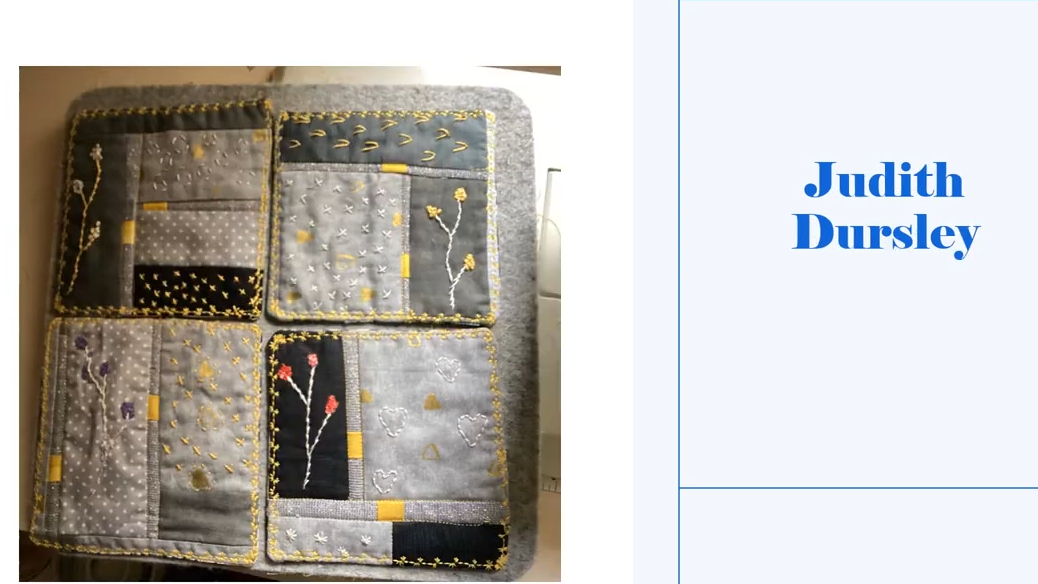 Four square coasters with a gray background. Each coaster features a small, colourful design, such as a flower or a geometric shape. The coasters have a yellow border. 