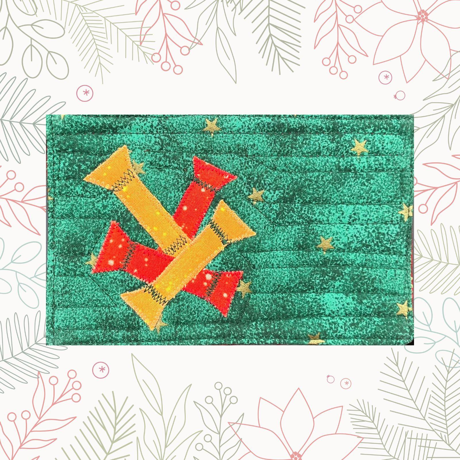 A rectangular quilt with a green background and a red border. The quilt features three candy cane shapes made from red and yellow fabric. The background is filled with small, gold stars. The quilt is quilted with loose waves