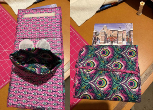 Handmade fabric pouch with a vibrant peacock-inspired pattern and multiple compartments for organisation