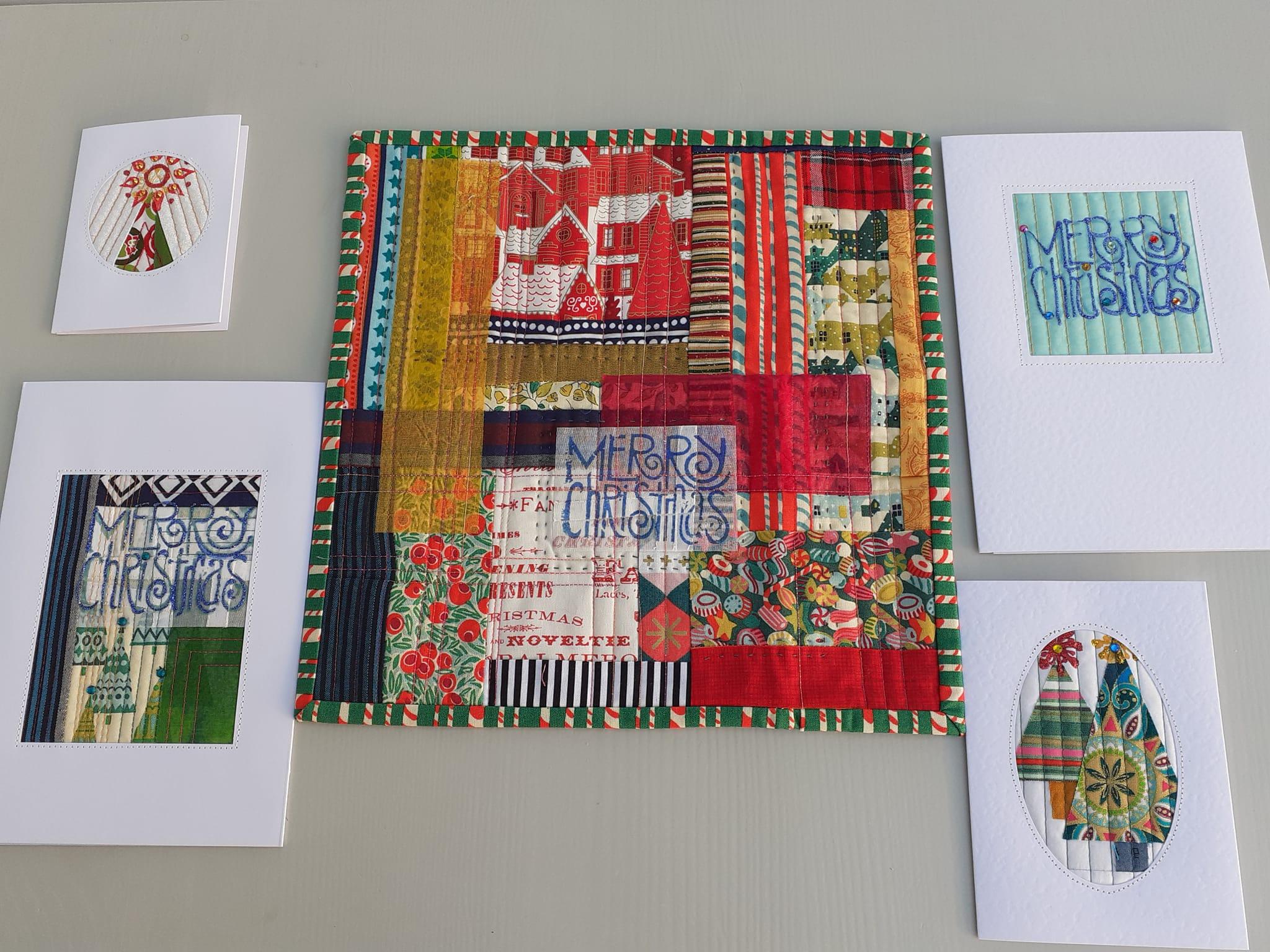 A festive patchwork mug rug, comprising of various strips of festive fabric and finished with a green festive candy cane decorated binding. Surrounding the mug rug are 4 Christmas cards with quilted fronts.
