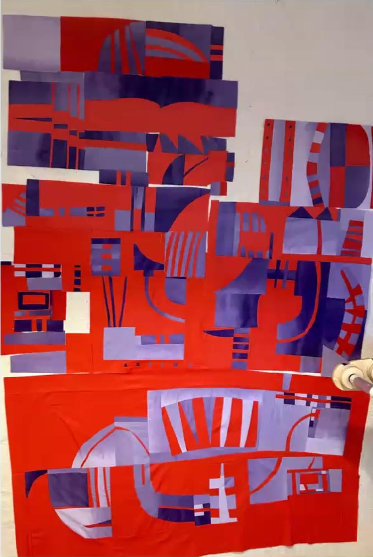 Improv quilt piece in the style of Irene Roderick dancing with the wall in red and purple