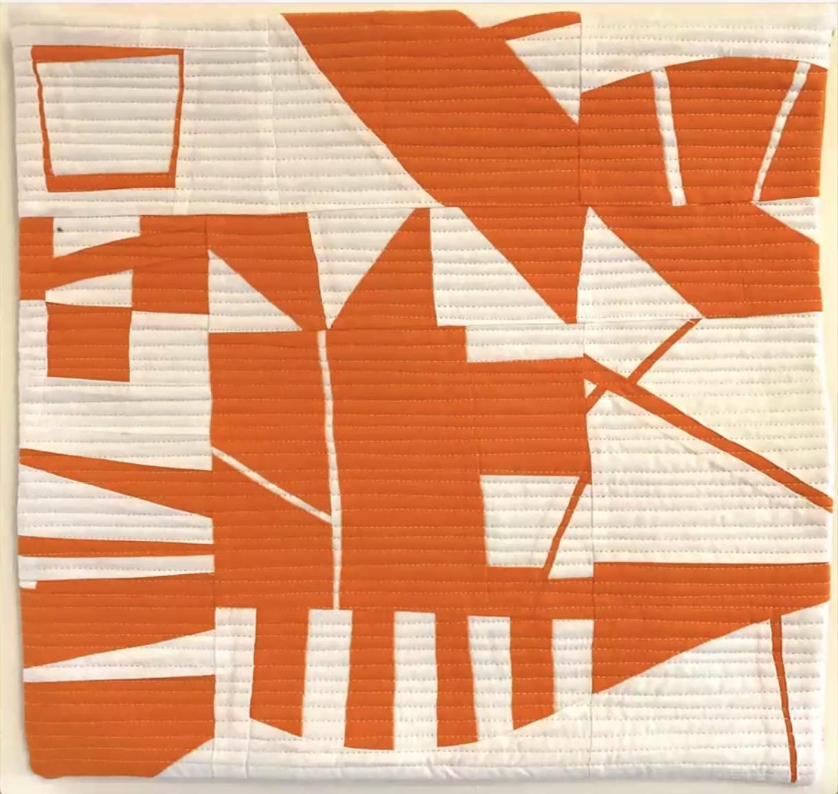 Improv quilt piece in the style of Irene Roderick dancing with the wall in orange and cream