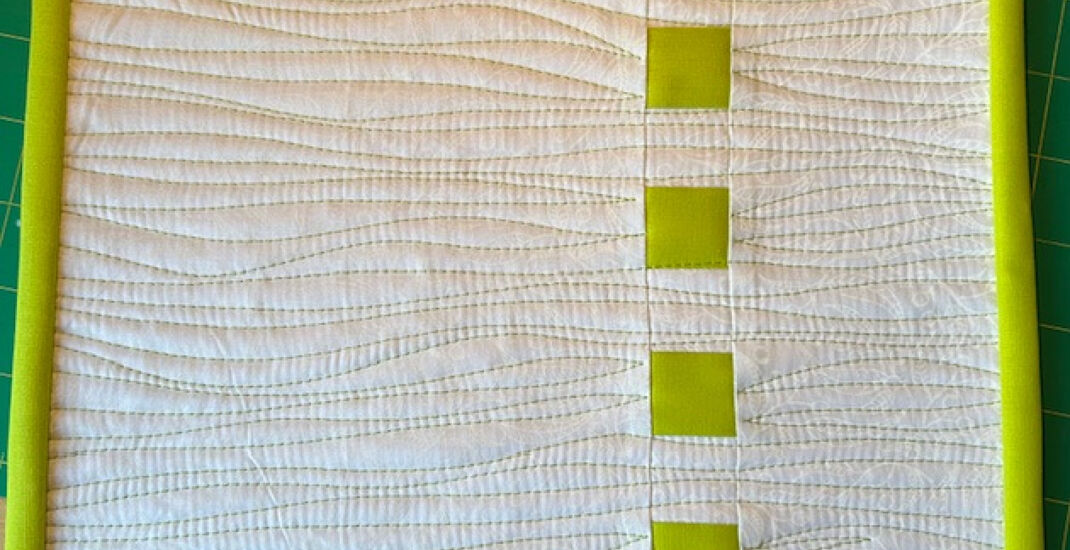 Take a line for a walk mini quilt by Jane Neal.