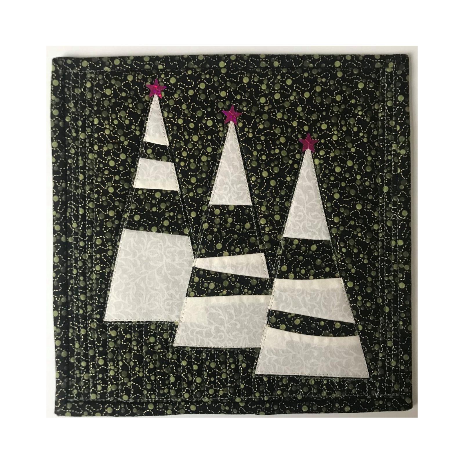 A square quilt with a black background. The quilt features three white Christmas trees with red stars on top. The background is filled with small, gold circles.