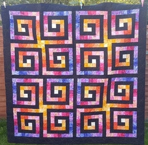 Purple, pink and orange quilt by Pippa Moss