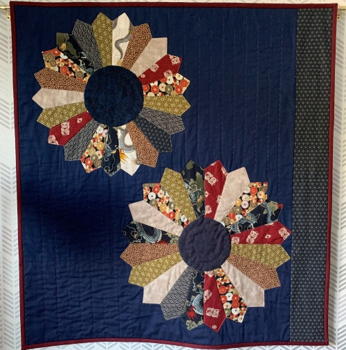 Navy quilt with 2 large flowers by Tanja Burlison