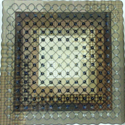 Quilt with brown and neutral concentric squares with a grid with flowers overlaid